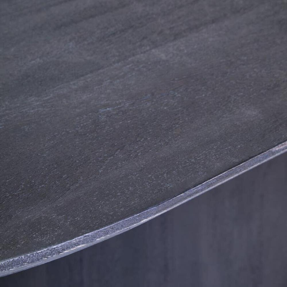 Black mango oval dining table on a white background zoom in view