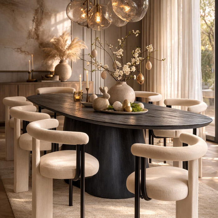 Dining room with a dark wooden table and modern chairs, featuring decorative elements.